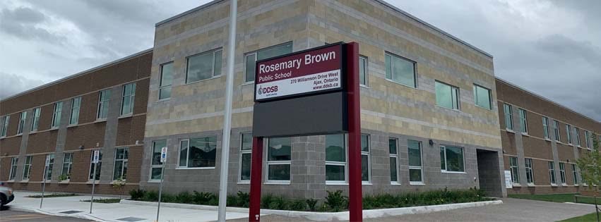 Rosemary Brown Public School in Ajax — two-storey stone and brick school with its Durham District School Board sign at the corner
